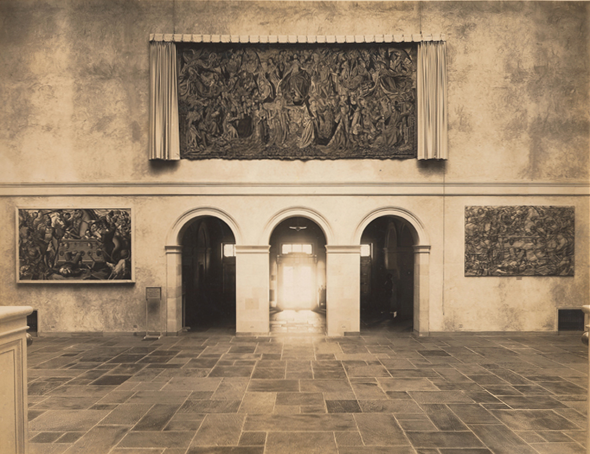 The Renaissance Court showing the Salisbury Street entrance inside the 1933 addition. The Last Judgement, a 14th-century tapestry (1935.2) purchased in 1935, is displayed above the entrance