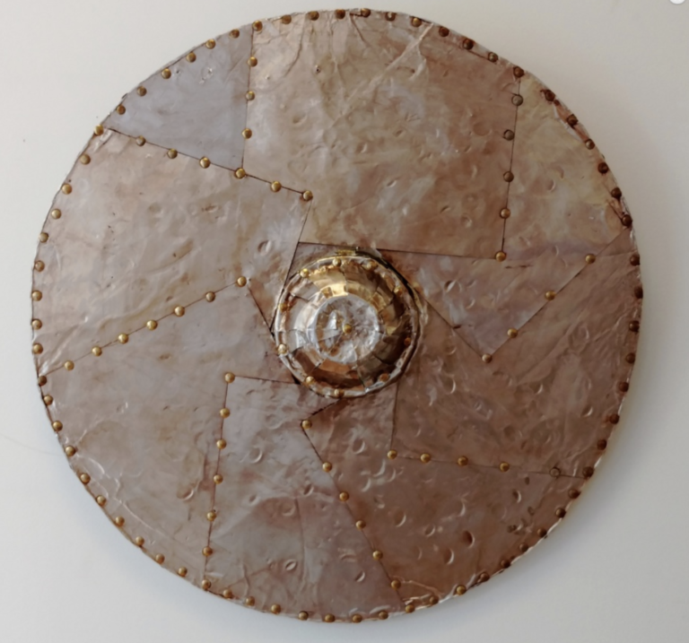 An artwork resembling a round medieval shield