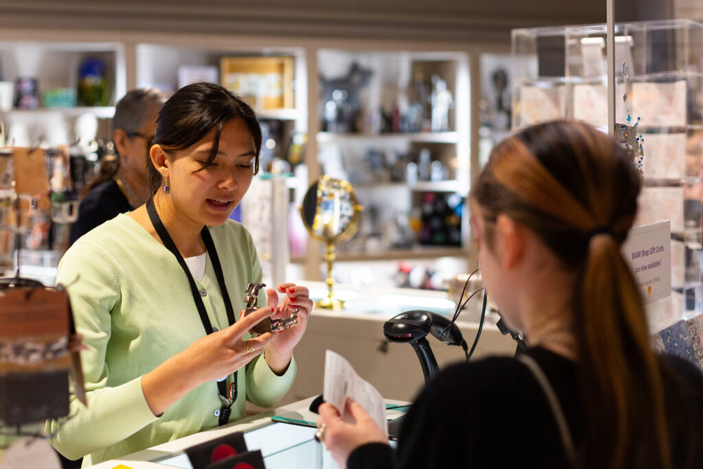 A visitor checks out at the WAM shop