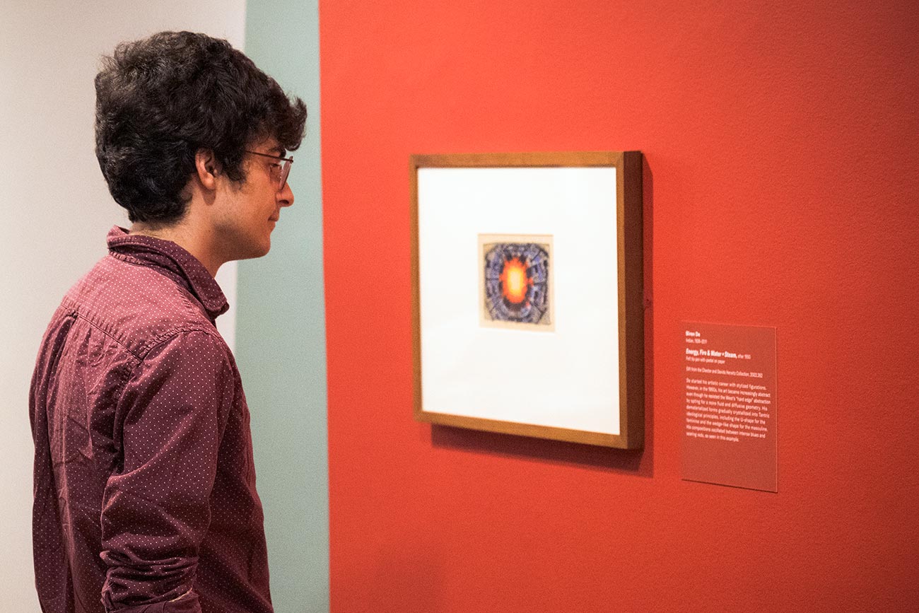 A visitor viewing a work in the exhibition 'Im/Perfect Modernisms'