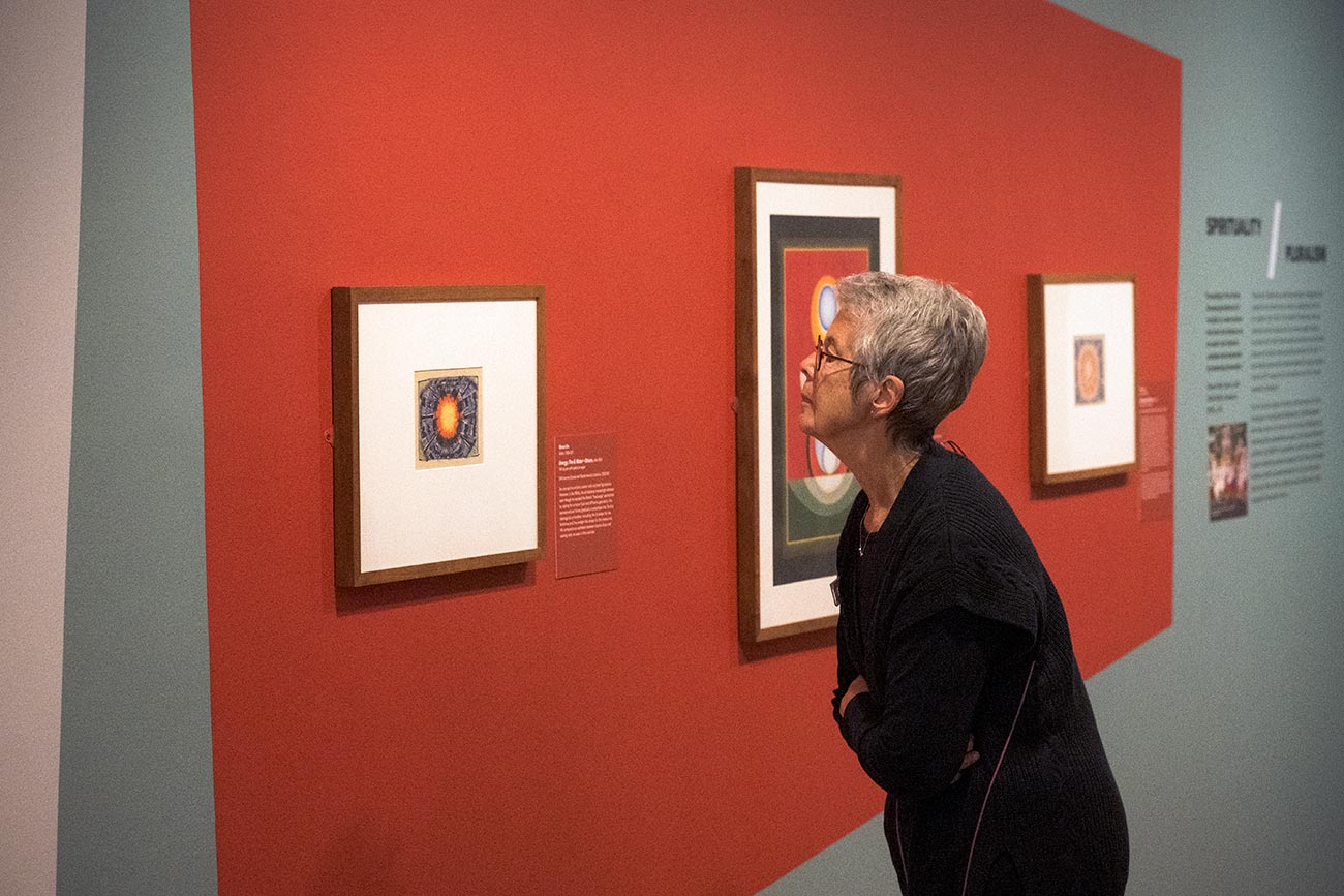 A visitor viewing works in the exhibition 'Im/Perfect Modernisms'