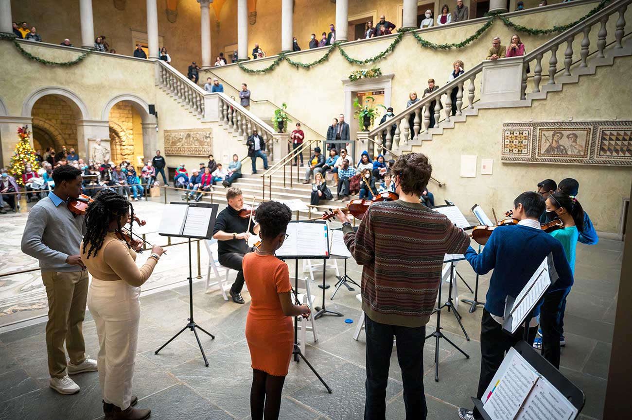 Young musicians performing in a group in Renaissance Court