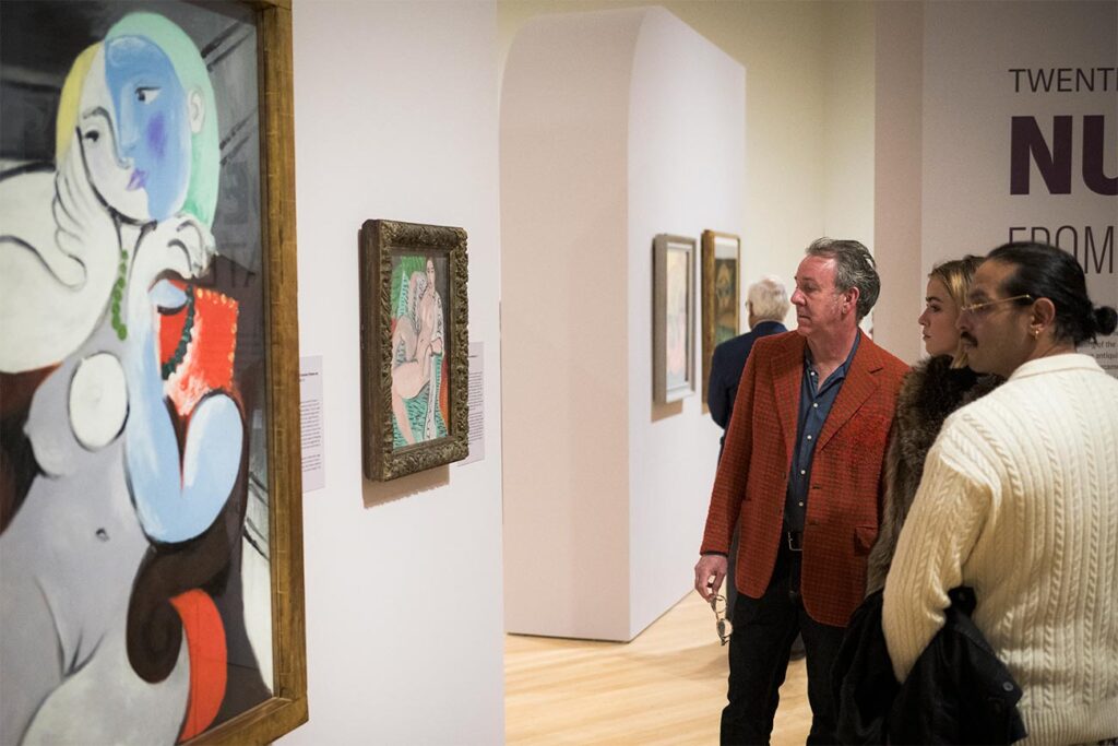 Visitors viewing works in the exhibition 'Twentieth-Century Nudes from Tate'