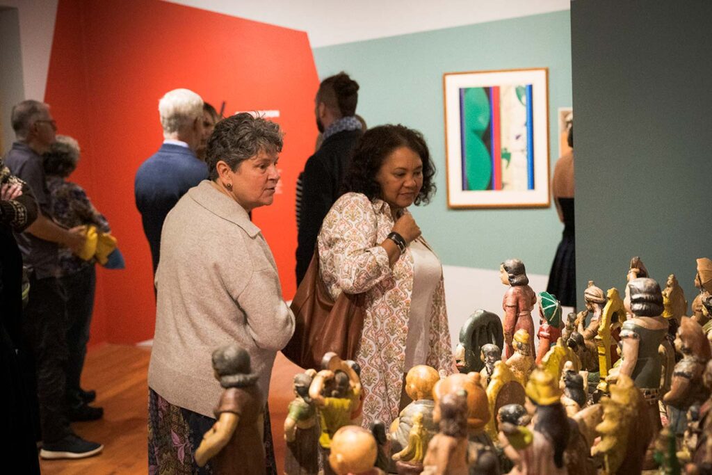 Visitors viewing works in the exhibition 'Im/Perfect Modernisms'