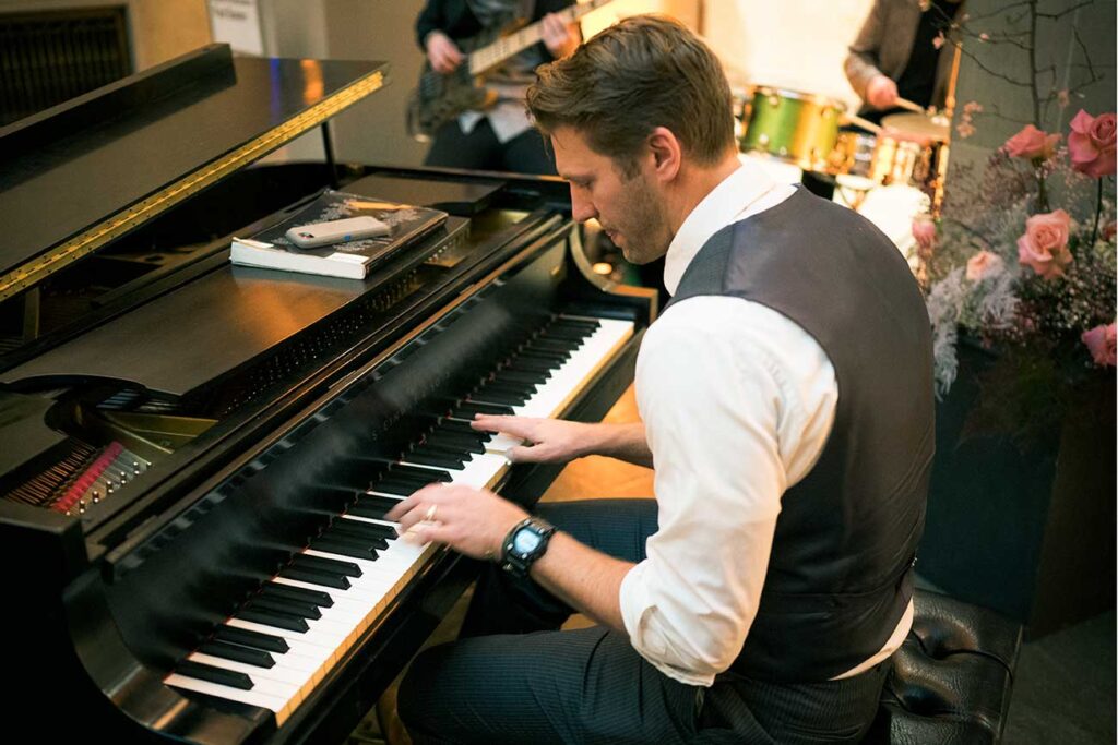 Paul Buono playing the piano in Renaissance Court